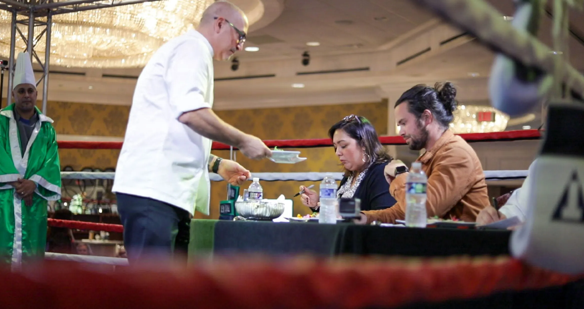 Chef Paul Basciano handing judges dishes