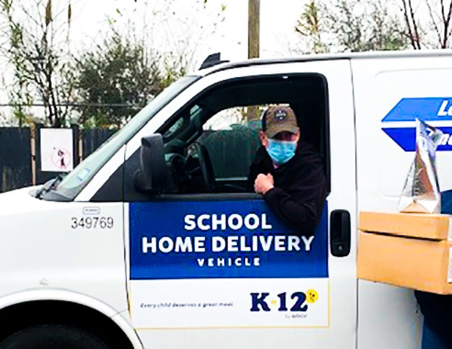 Delivery driver and employee delivering meals