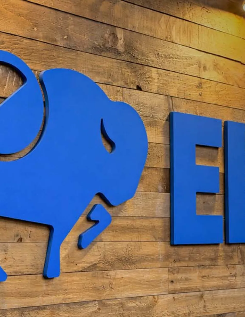 Elior logo on reclaimed wood wall