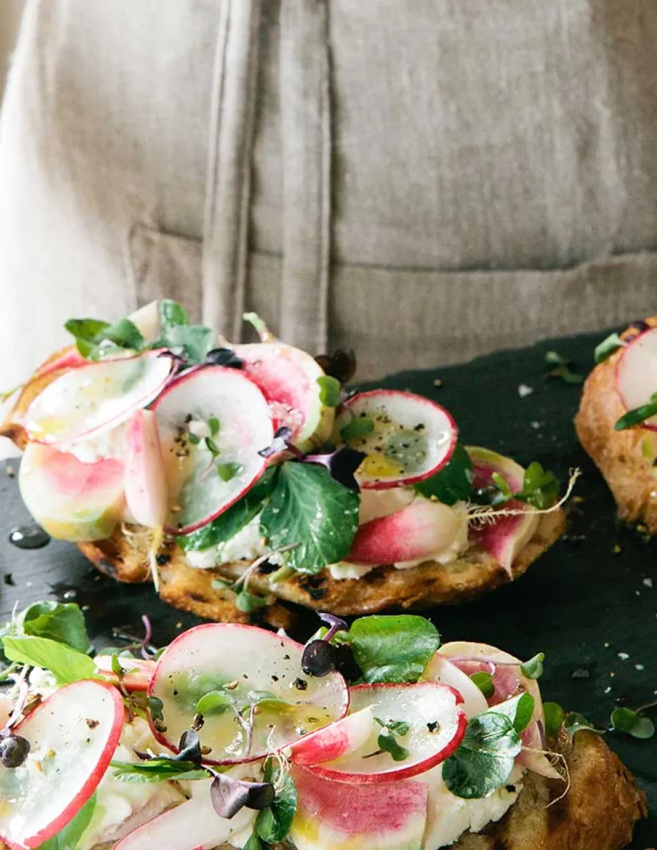 Tray of toast with radishes