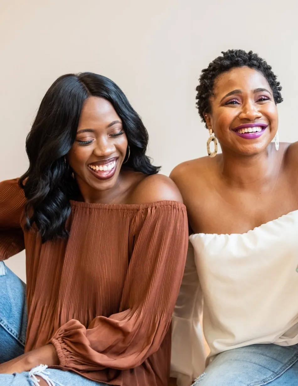 Two Black Women Smiling and Laughing Together