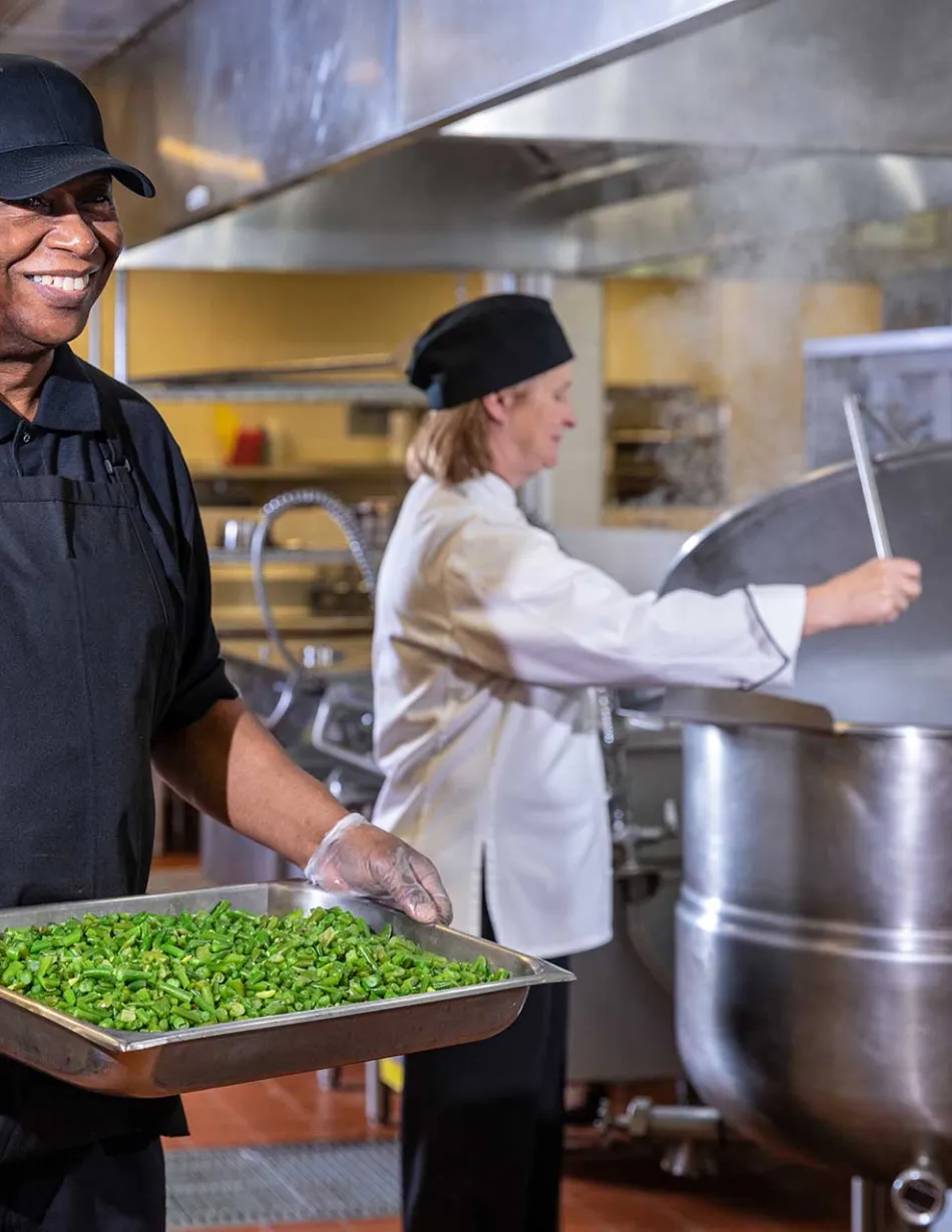 Two Summit employees cooking in kitchen