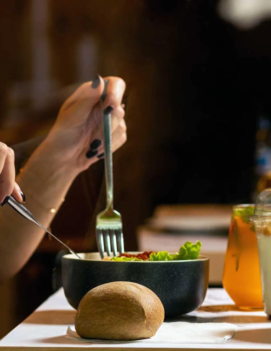 Person eating in restaurant