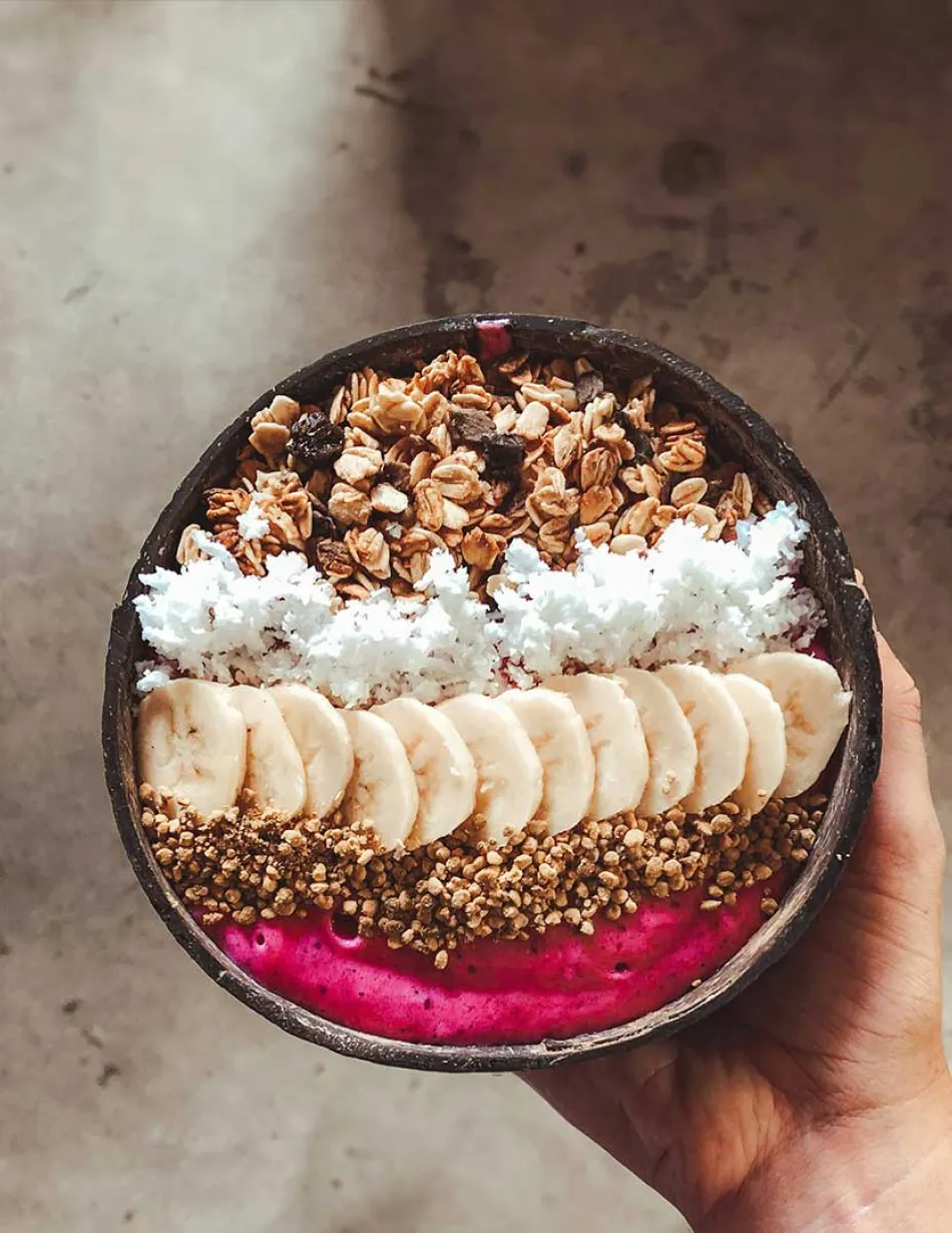 Smoothie bowl held in hand